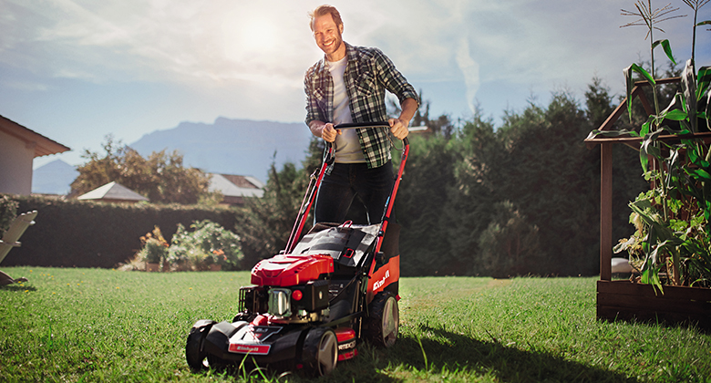 Man mowing grass with a lawn mower